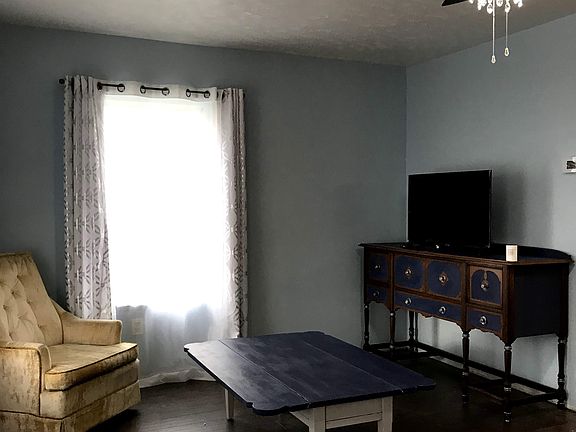 Living room flows into kitchen.