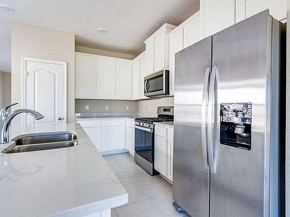 The stainless-steel kitchen appliances are a key feature in the Alafia