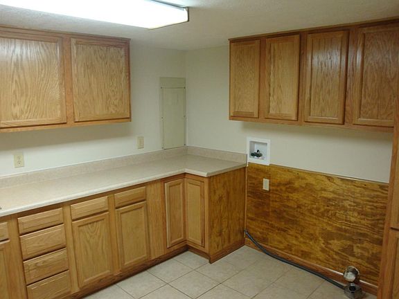 Large kitchen with laundry hookup, lots of cabinets