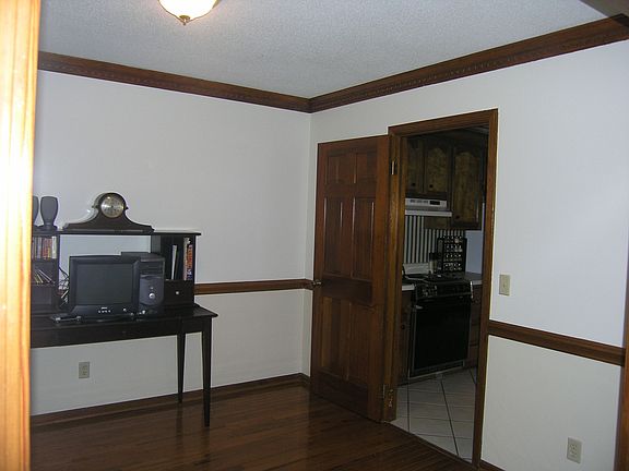 Formal Dining Room with Fresh Paint and Hardwood Flooring