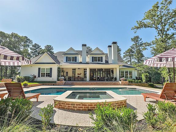 Beautiful backyard with spa, fire pit, outdoor kitchen and outdoor living area with additional fireplace accessible from family and kitchen area that is great for entertaining!!