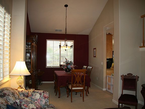 Formal dining area has tasteful two tone paint