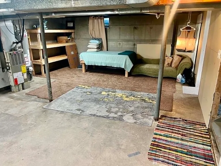 Basement with room for storage or extra recreational space.