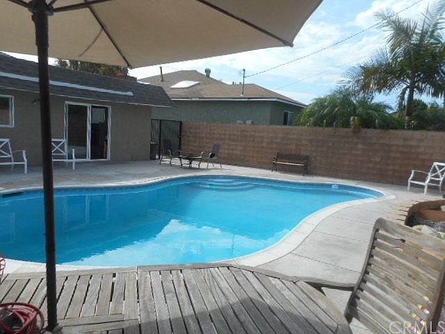 View of backyard facing towards sliding back door.