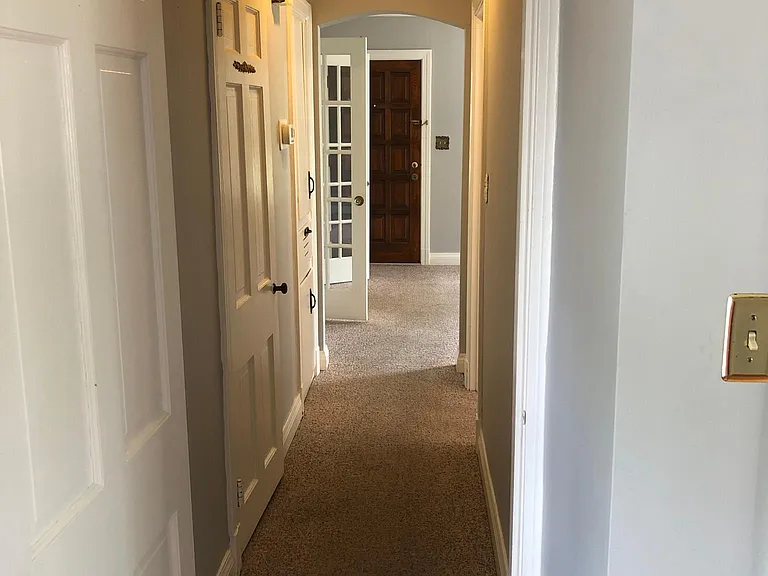 Hallway between both bedrooms on the main floor and the bathroom.