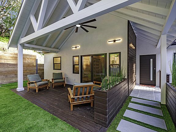 Front entry and covered outdoor area with bamboo deck and planters