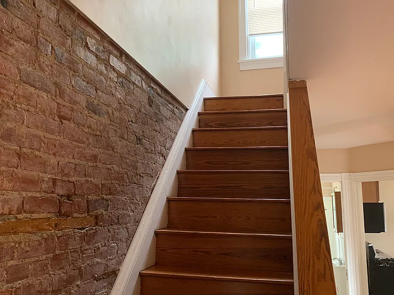 From living area looking up stairs to bedrooms