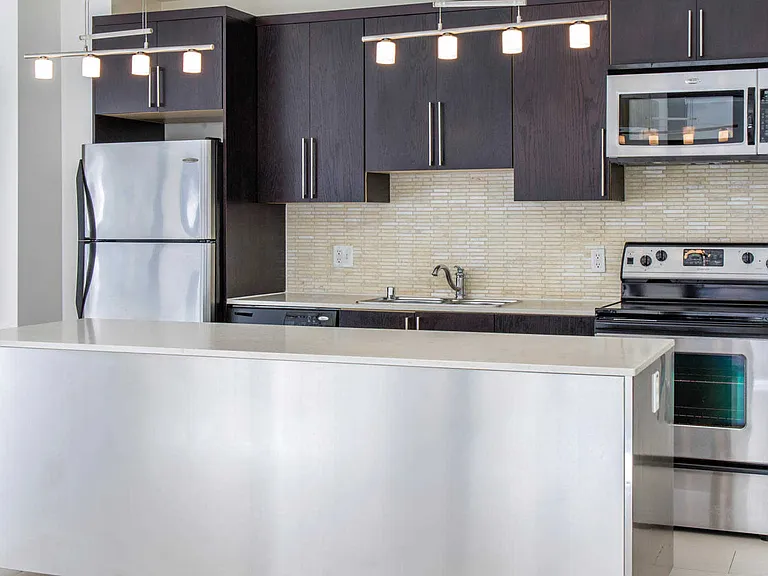 Kitchen with Island and Stainless Steel Appliances