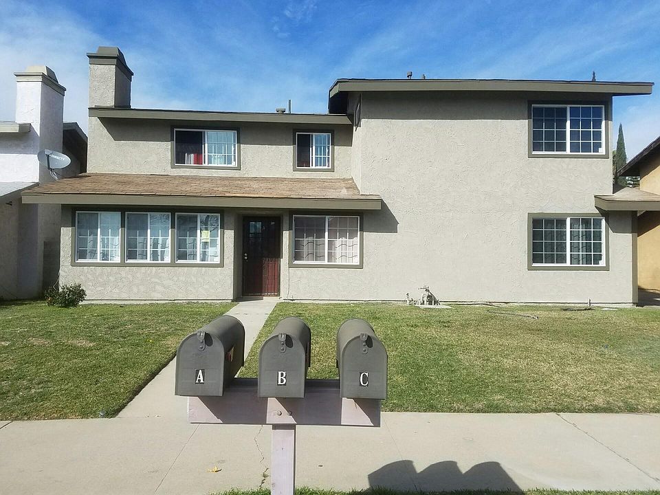 Front View. Apt for rent is upstairs unit stretching from left to right
