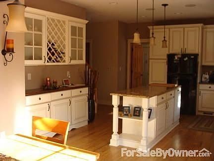 Built in Buffet : View of island, buffet, & wine rack. Doorway in center background is to mudroom
