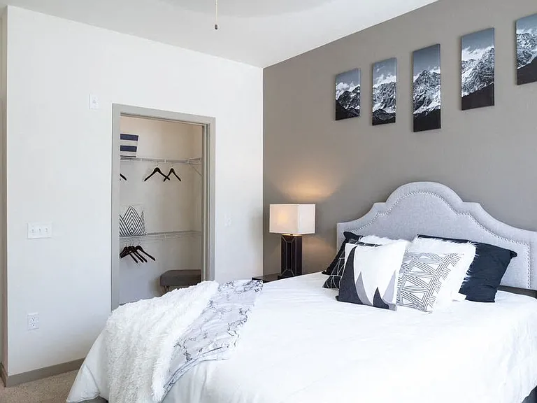 Centro Apartments model bedroom and open closet