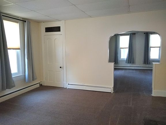 Living Room with door to walk in closet/pantry