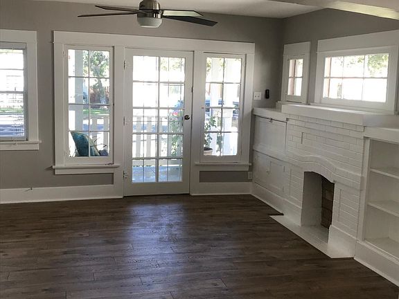 Entry/ Living room with built ins. Faux fireplace, ceiling f