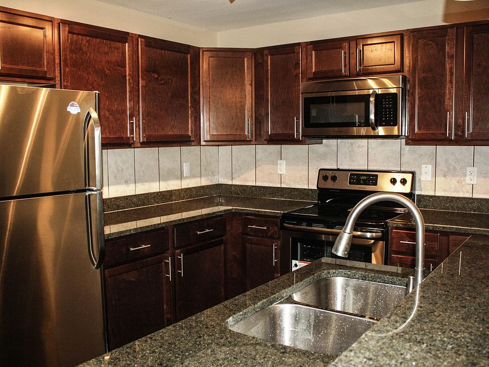 Beautiful wood cabinets and green granite countertops