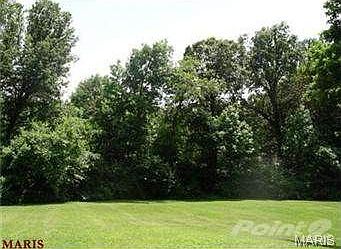 1 acre lot backs to trees