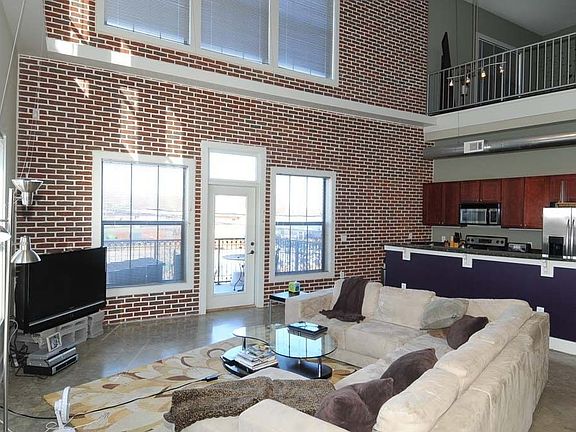 Living room opening to outside balcony.