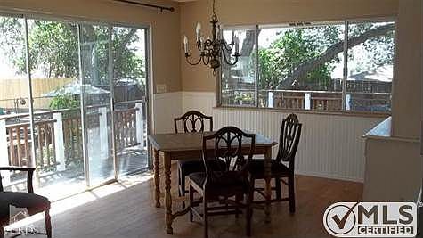 Phenomenally picturesque views from all windows. Formal dining area with slider onto recently re-fin