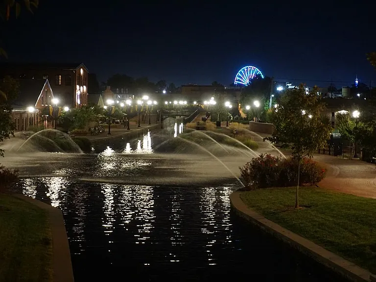 Carroll Creek's Galleria Fountain, just a few steps from the parking area. The Great Frederick Fair's Ferris Wheel is visible in the background.