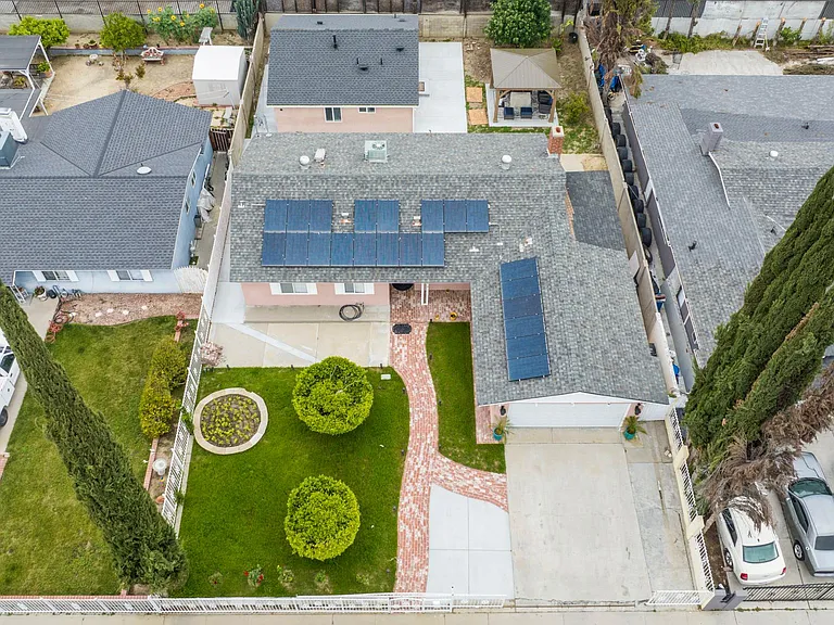 DRONE VIEW OF THE ENTIRE PROPERTY FACING THE STREET.THE RENTAL PROPERTY IS AT THE BACK.