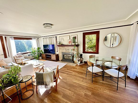 Living Room with balcony & gas fireplace