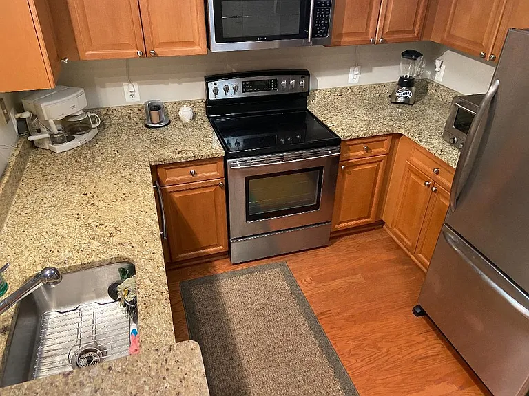Kitchen: granite and new stainless steel appliances