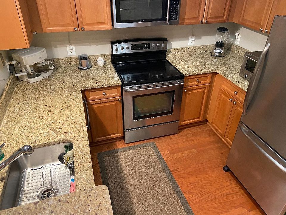 granite and stainless steel appliance kitchen