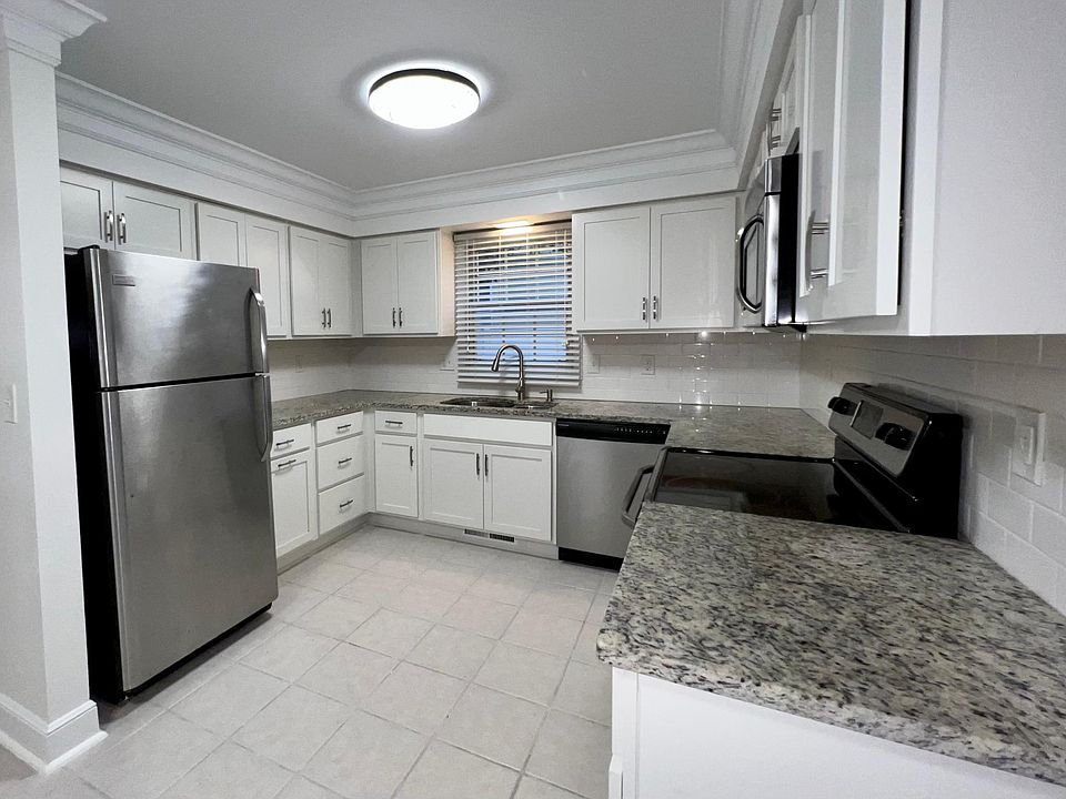 Updated kitchen with soft close cabinetry, granite countertops, and stainless steel appliances.