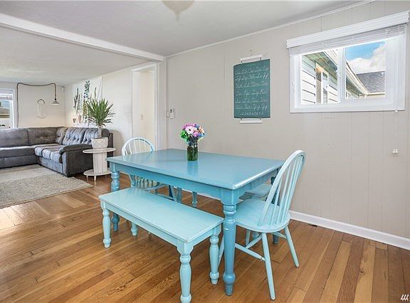 Dining room with beautiful original hard wood floors.