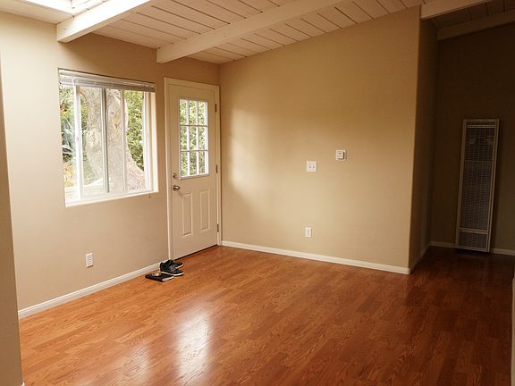 bright, open plan dining area with skylight