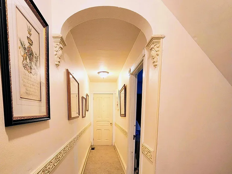 Stunning arched second floor hallway