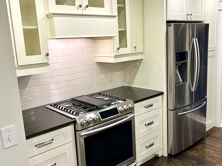 Upscale kitchen w/ stainless steel appliances including a 5-burner gas range, French door refrigerator, Bosch dishwasher, and drawer microwave!