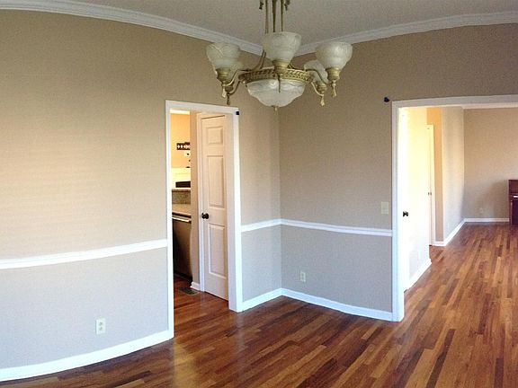 Front, formal dining room with chair railing, hardwoods throughout first floor