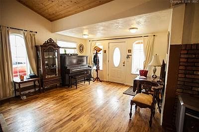 Entry has lovely hard wood floors.