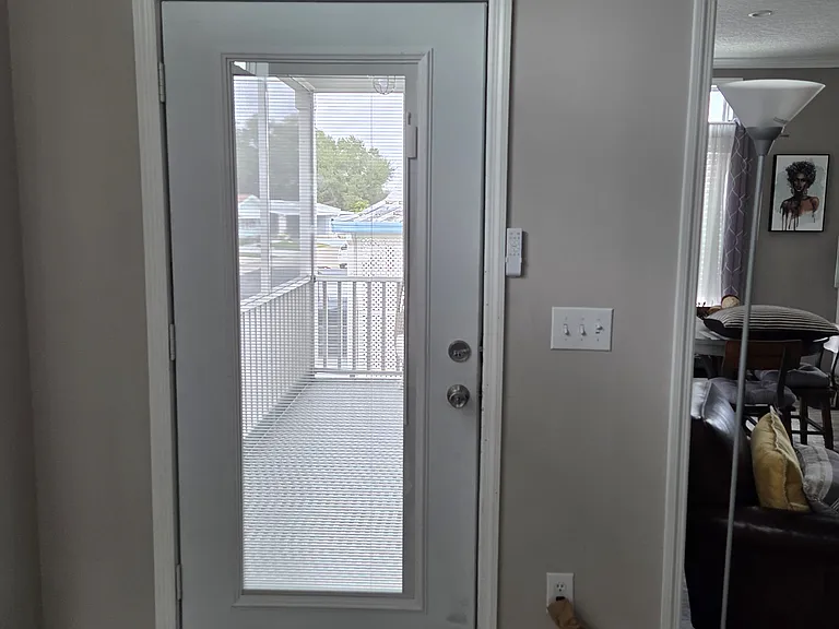 Newly added front door storm door with inserted shade