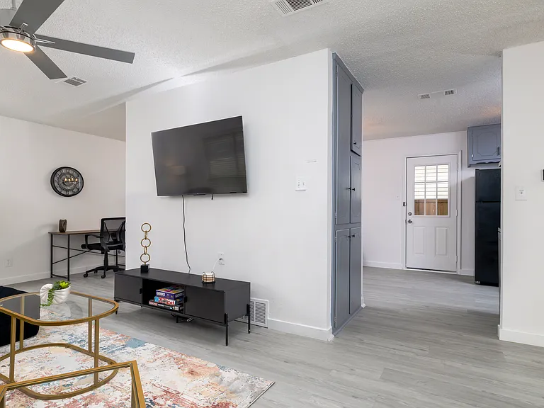 Spacious living room with plenty of seating for friends and family.