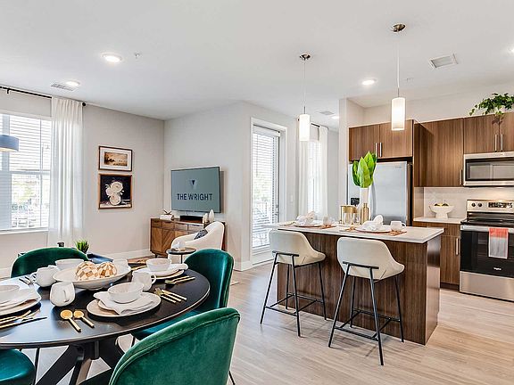 Bright, modern interiors at The Wright feature open-concept layouts, quartz countertops, stainless-steel appliances, and contemporary finishes designed for everyday living.