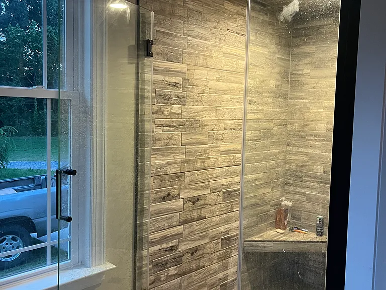 The hand tiled walk-in shower.