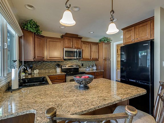beautiful granite and fridge conveys