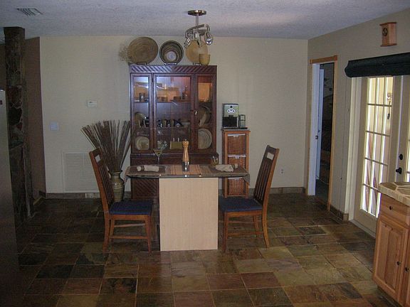 12x13eat-in kitchen surrounded in Stone, French doors