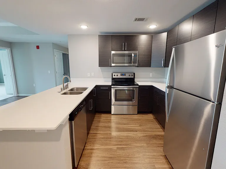 Stainless steel appliances _ including a dishwasher, electric stove, and microwave _ are included in the 3-bedroom apartment. Stainless steel appliances _ including a dishwasher, electric stove, and microwave _ are included in the 3-bedroom apartment.