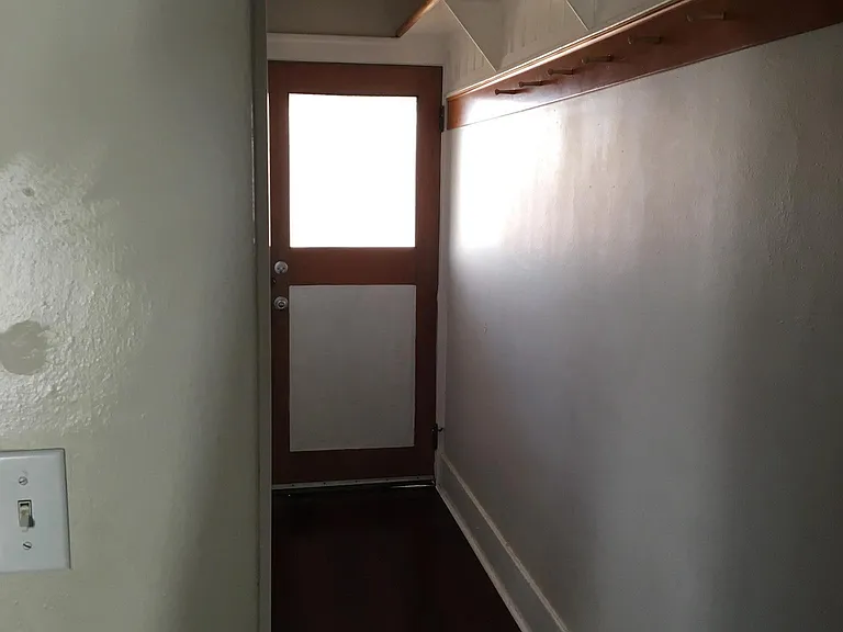 Hallway with door to back porch and garden