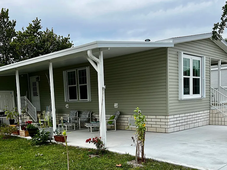 Private covered Lanai, golf cart and large 2 car driveway