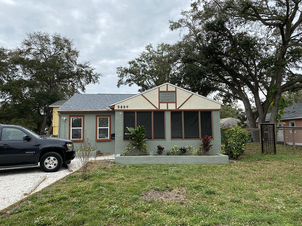 Large front yard with two parking spaces included