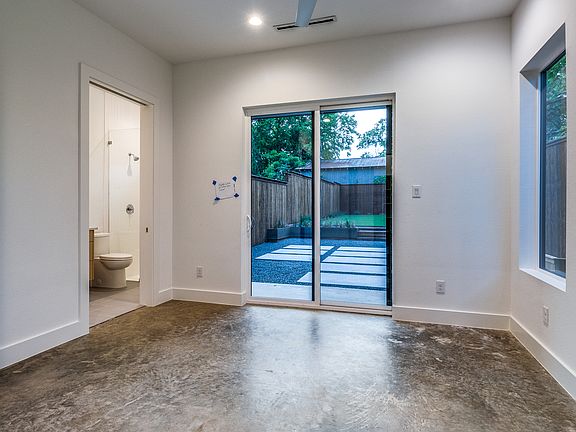 First floor bedroom has direct access to the backyard.