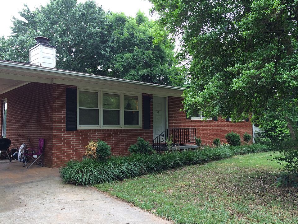 Front of house with carport