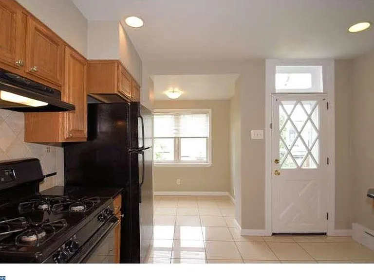 kitchen with breakfast room and access to rear yard