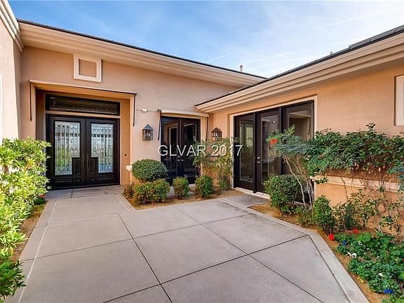 Elegant Beveled Glass Doors lead to Main Entry  through Courtyard.   French Doors lead to  Second Bedroom