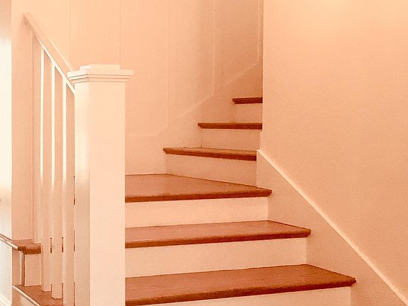 spacious foyer with stairs leading to 3 bedrooms, 2 bathrooms, and play or study area