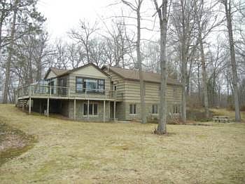 A shot of the back of the home.  You'll see the addition on the left side and also the deck and walk-out basement.