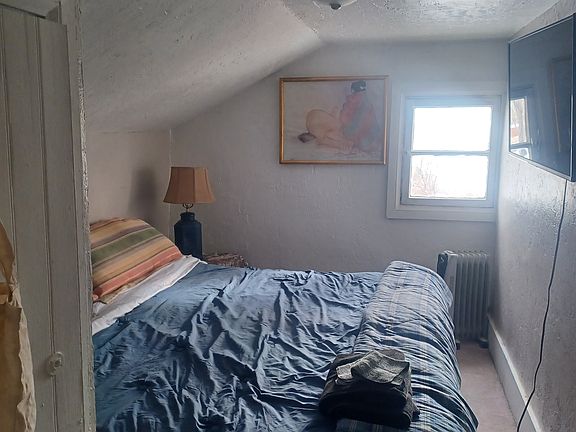 Upstairs bedroom with view to orchard